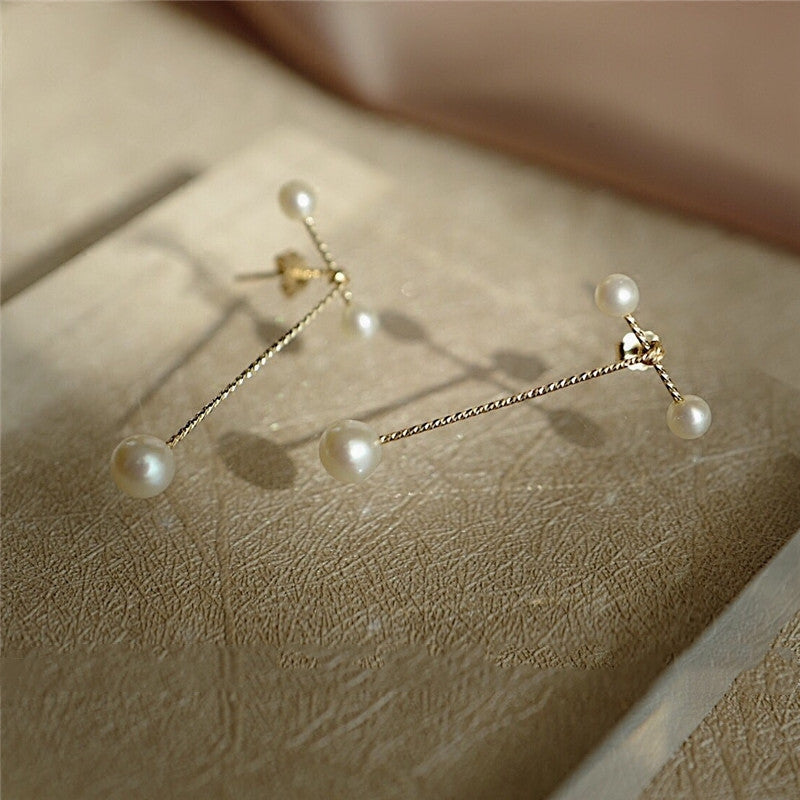 Geometric earrings with pearl earrings
